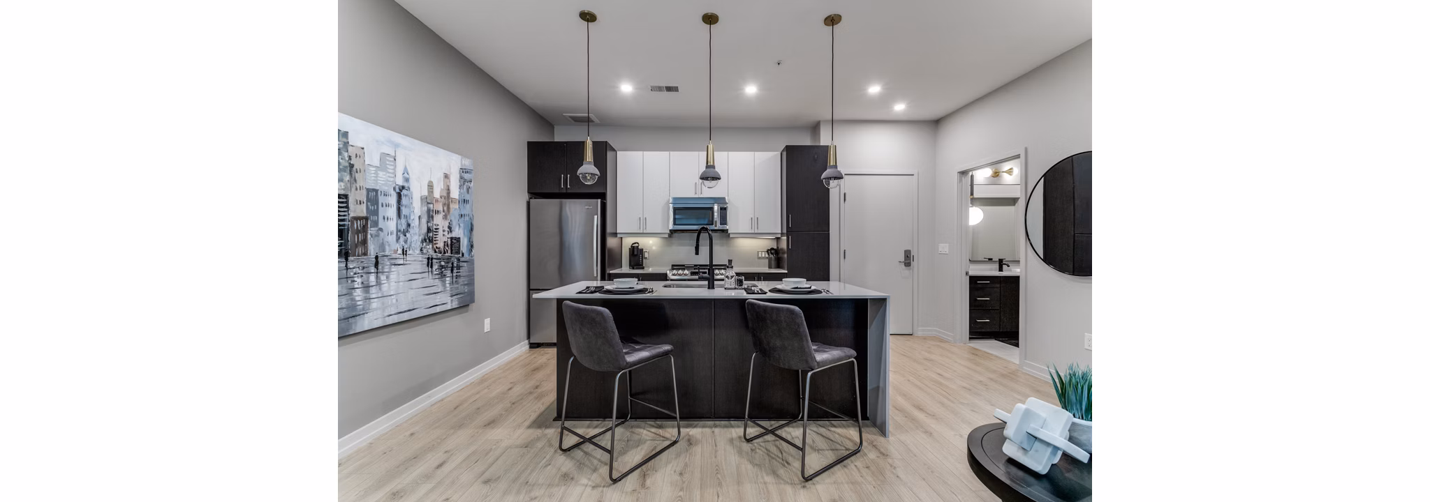 Modern kitchen with stainless steel appliances in 3700M Apartments