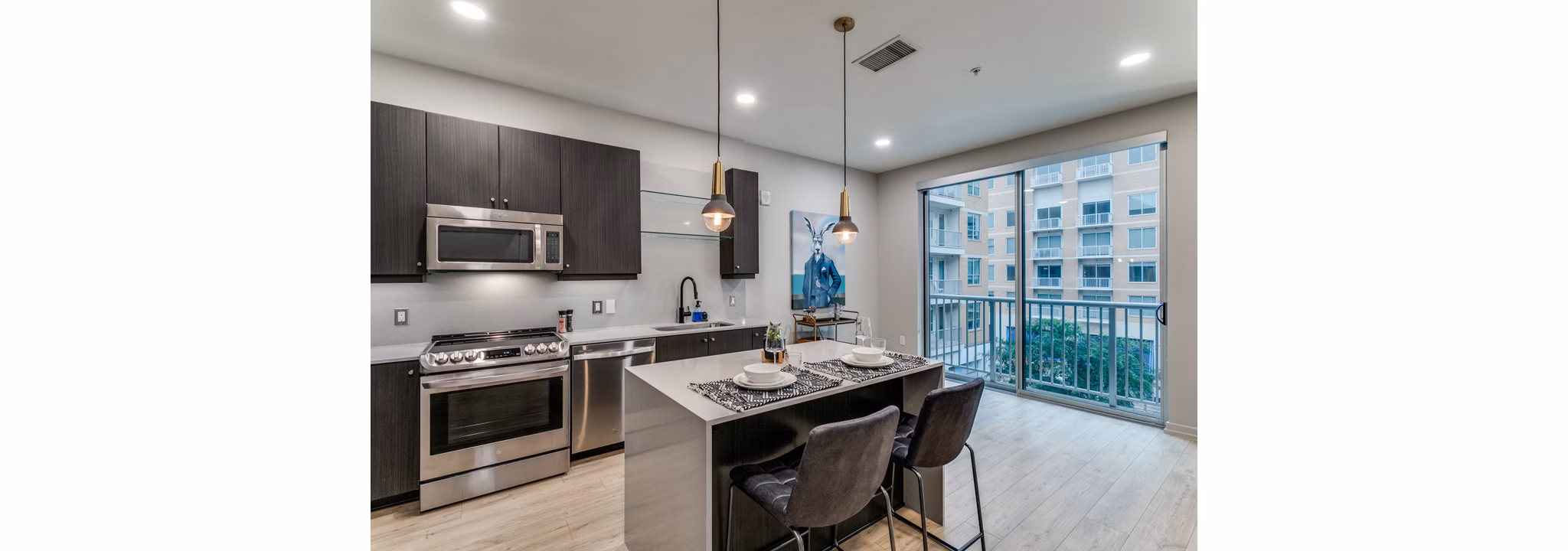 Modern kitchen with sleek cabinetry and stainless steel appliances at 3700M Apartments