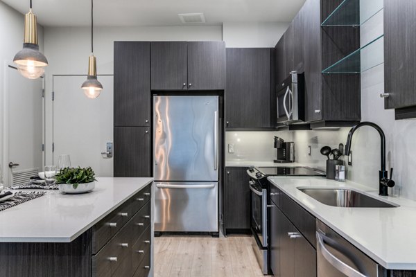 Modern kitchen with sleek cabinetry and stainless steel appliances at 3700M Apartments, a Greystar luxury property in the heart of the city