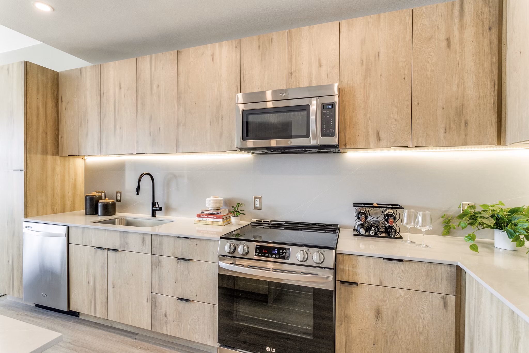 Modern kitchen with stainless steel appliances at 3700M Apartments, offering luxury living in a sophisticated atmosphere