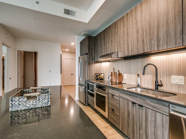 Modern kitchen with stainless steel appliances at 3700M Apartments in the heart of luxury living, perfect for culinary enthusiasts