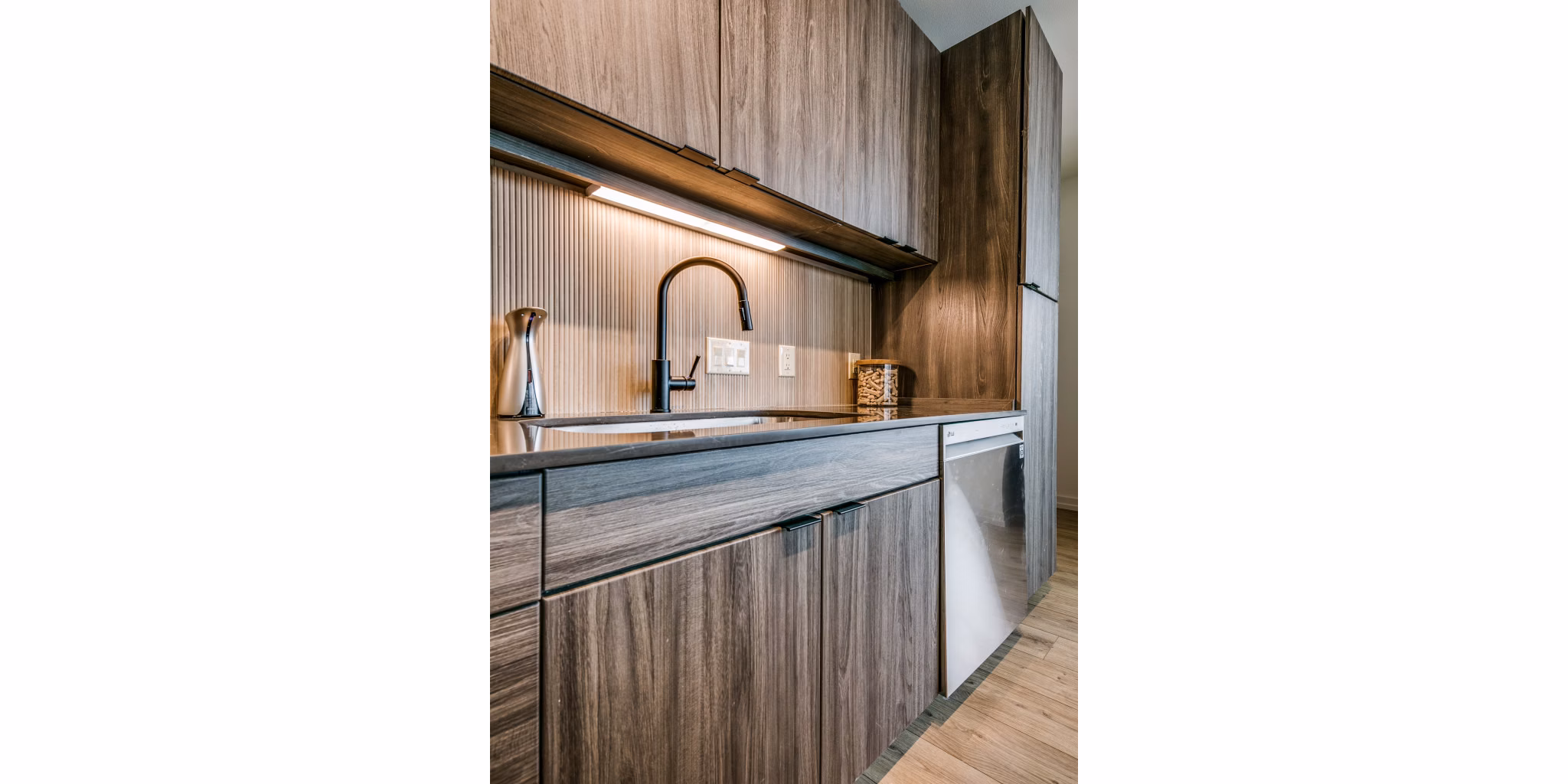 Modern kitchen with sleek countertops and stainless steel appliances at 3700M Apartments