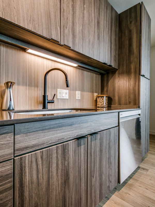 Modern kitchen with sleek countertops and stainless steel appliances at 3700M Apartments
