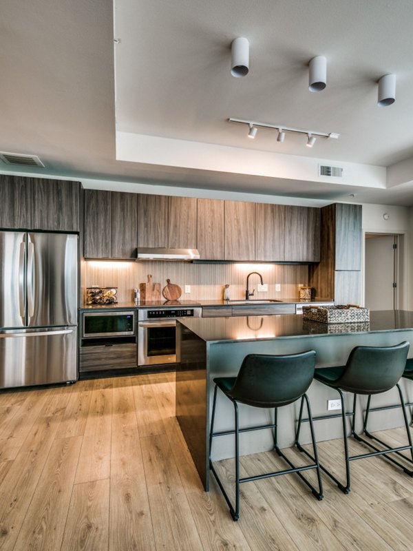 Modern kitchen with stainless steel appliances at 3700M Apartments