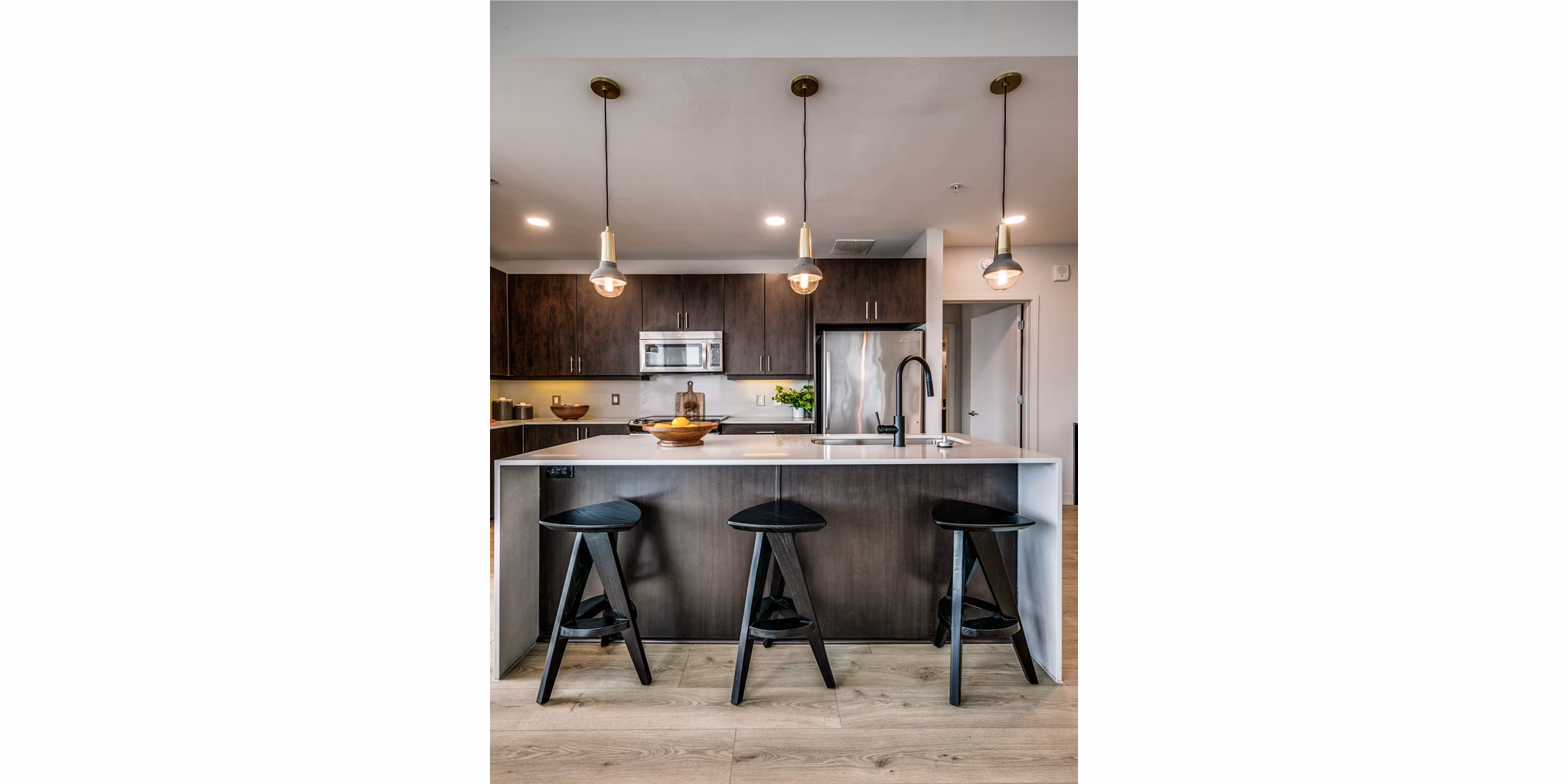 Modern kitchen with sleek countertops and stainless steel appliances at 3700M Apartments