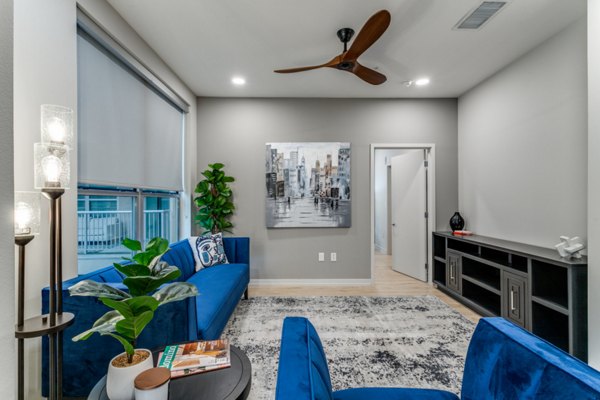 Spacious living room with contemporary furnishings at 3700M Apartments, offering luxury living in an urban setting