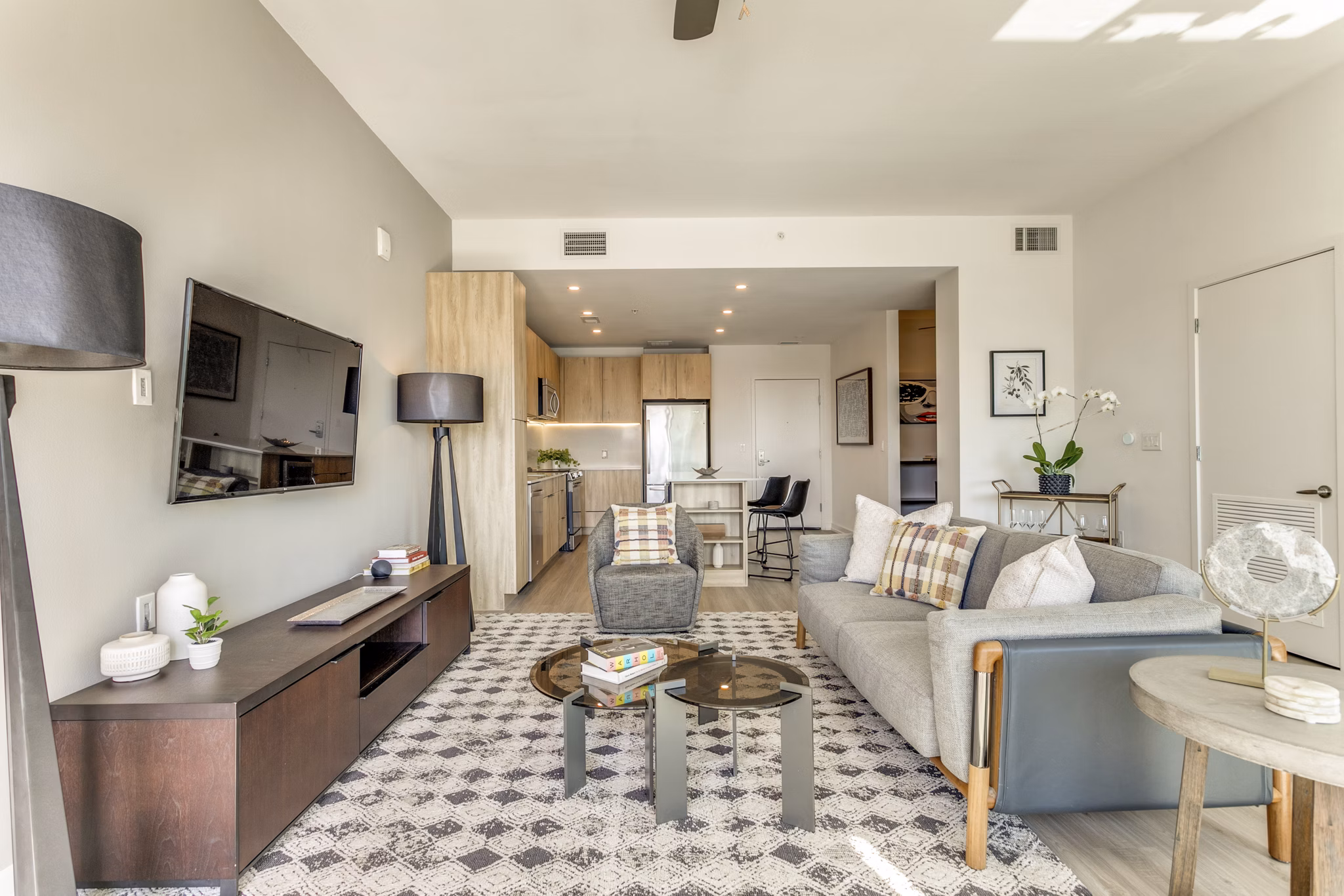 Spacious living room with modern furnishings at 3700M Apartments - luxury rentals in urban setting