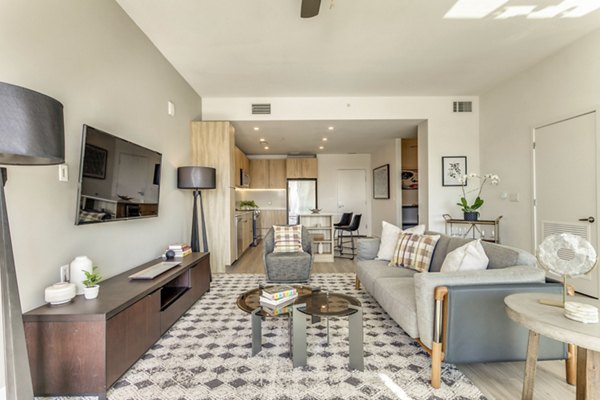 Spacious living room with modern furnishings at 3700M Apartments - luxury rentals in urban setting