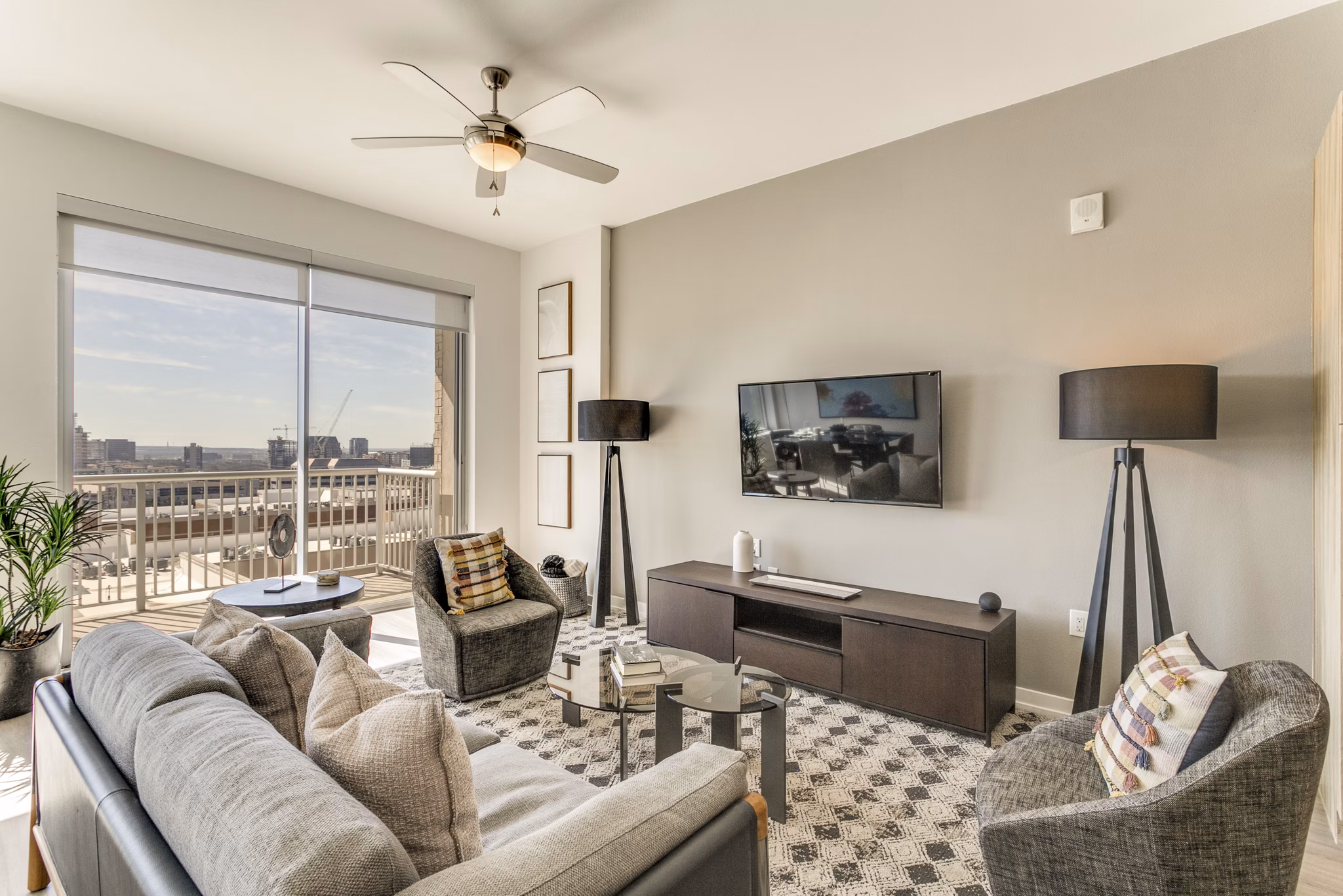 Spacious living room with modern furnishings at 3700M Apartments, featuring luxury amenities and elegant design