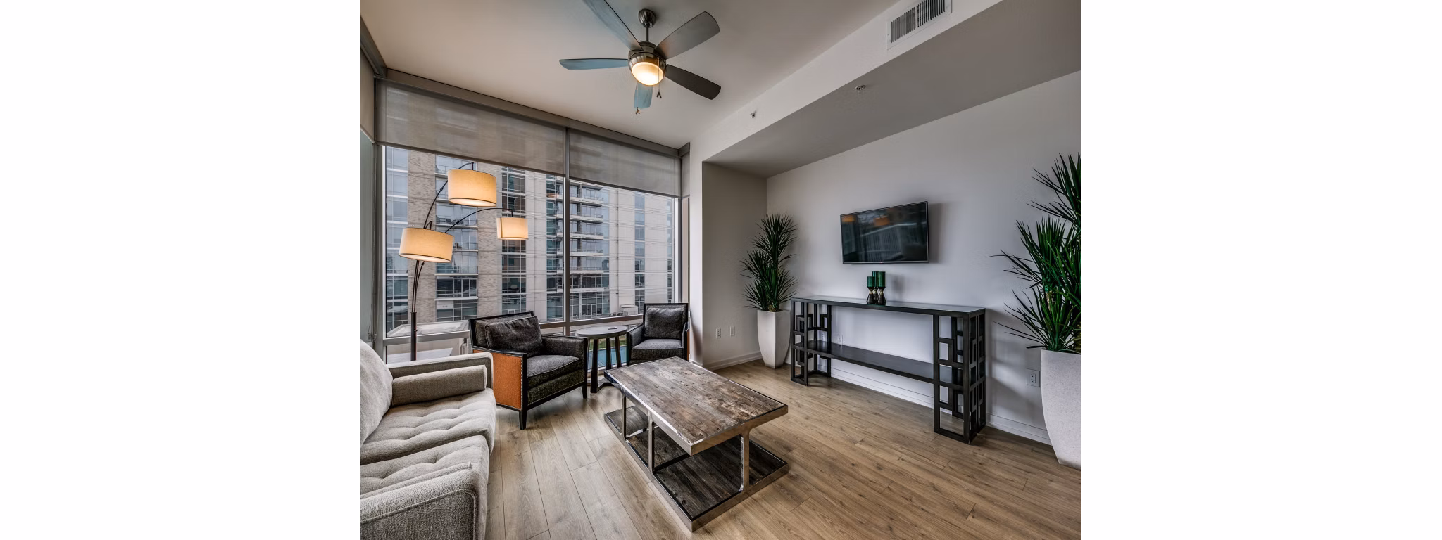 Spacious living room with modern furnishings at 3700M Apartments