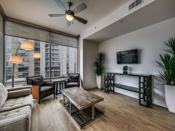 Spacious living room with modern furnishings at 3700M Apartments