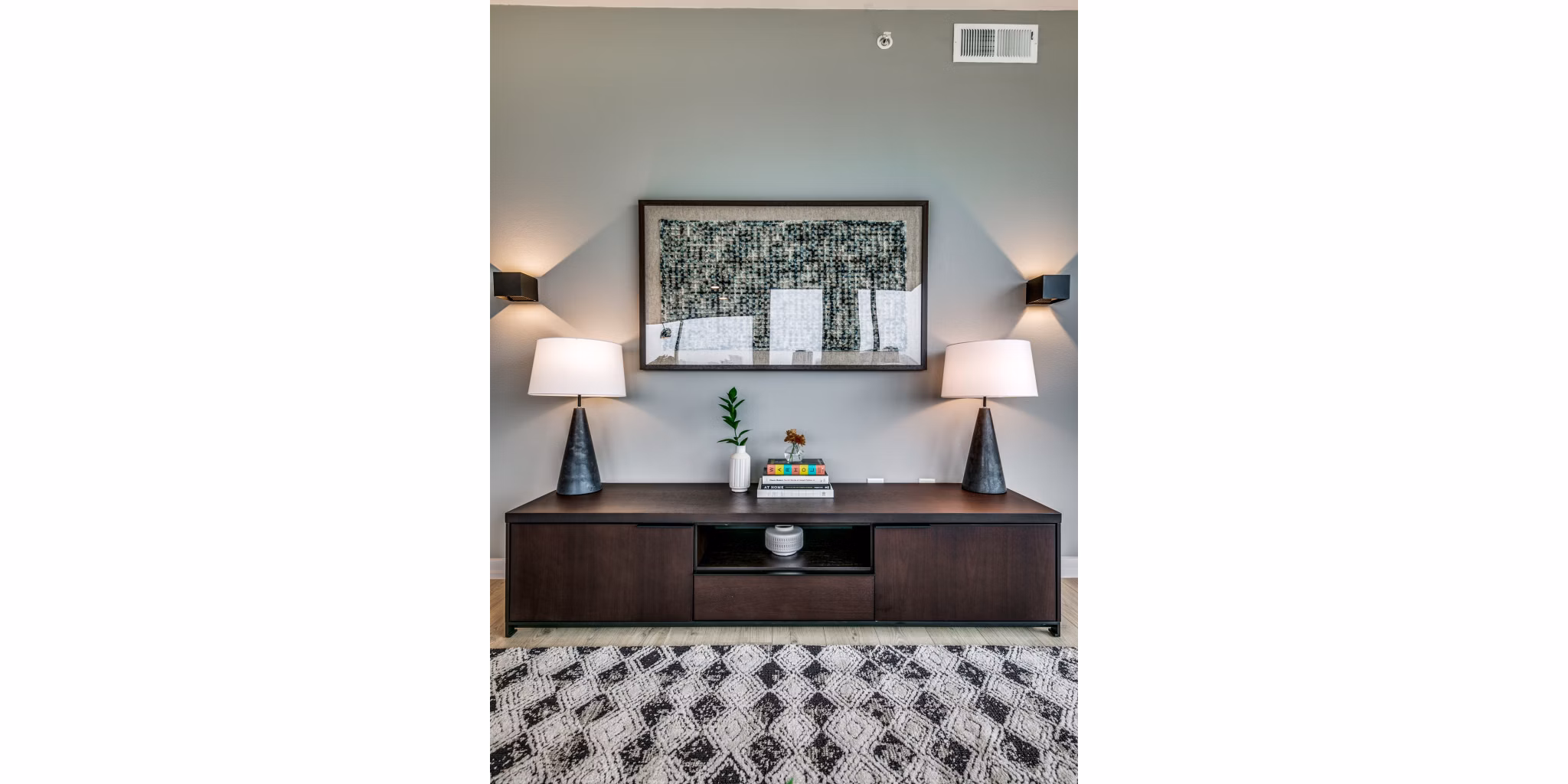 Spacious living room with modern furnishings and large windows in 3700M Apartments