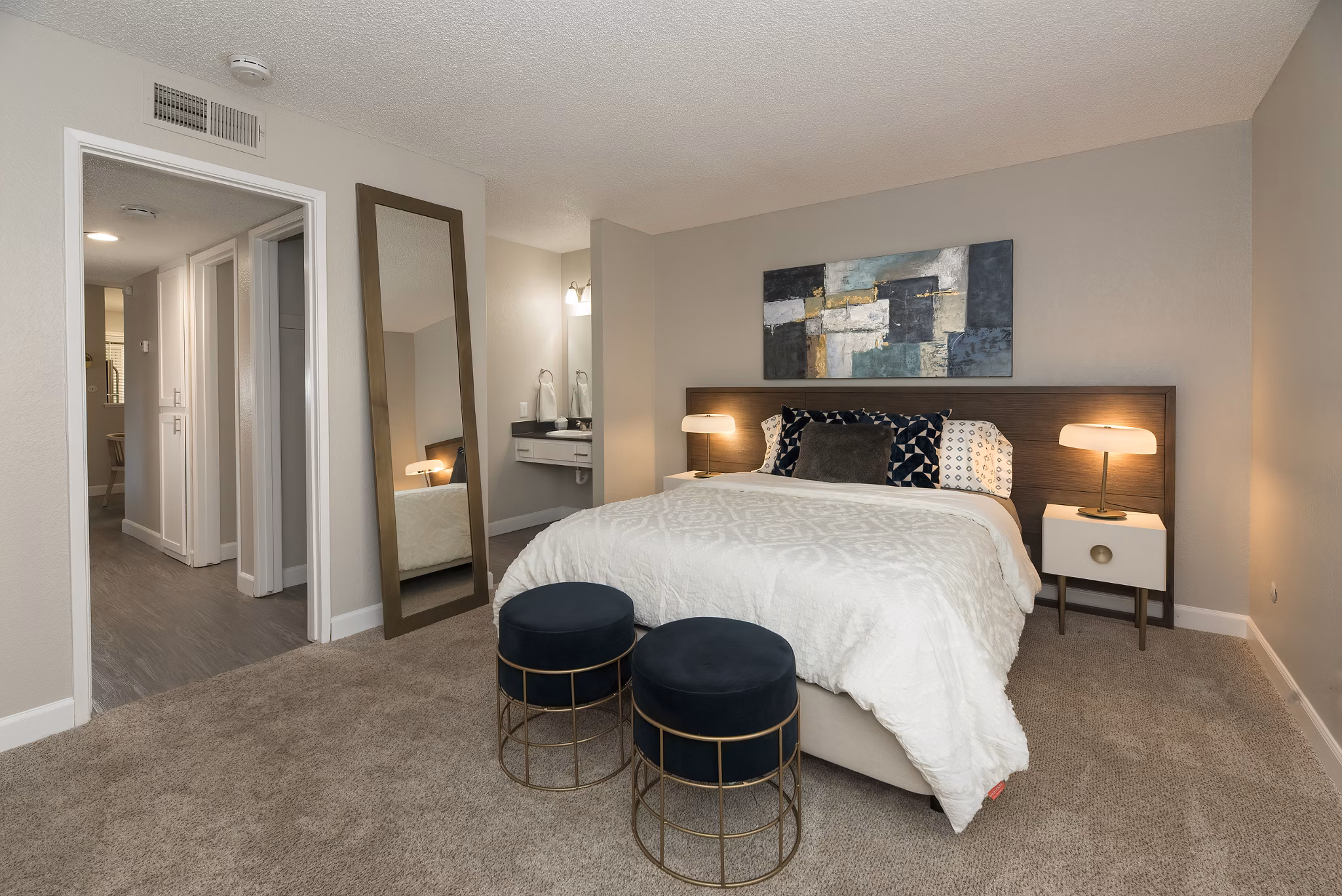 Cozy bedroom with modern decor at The Hills Apartments, a luxury property by Greystar