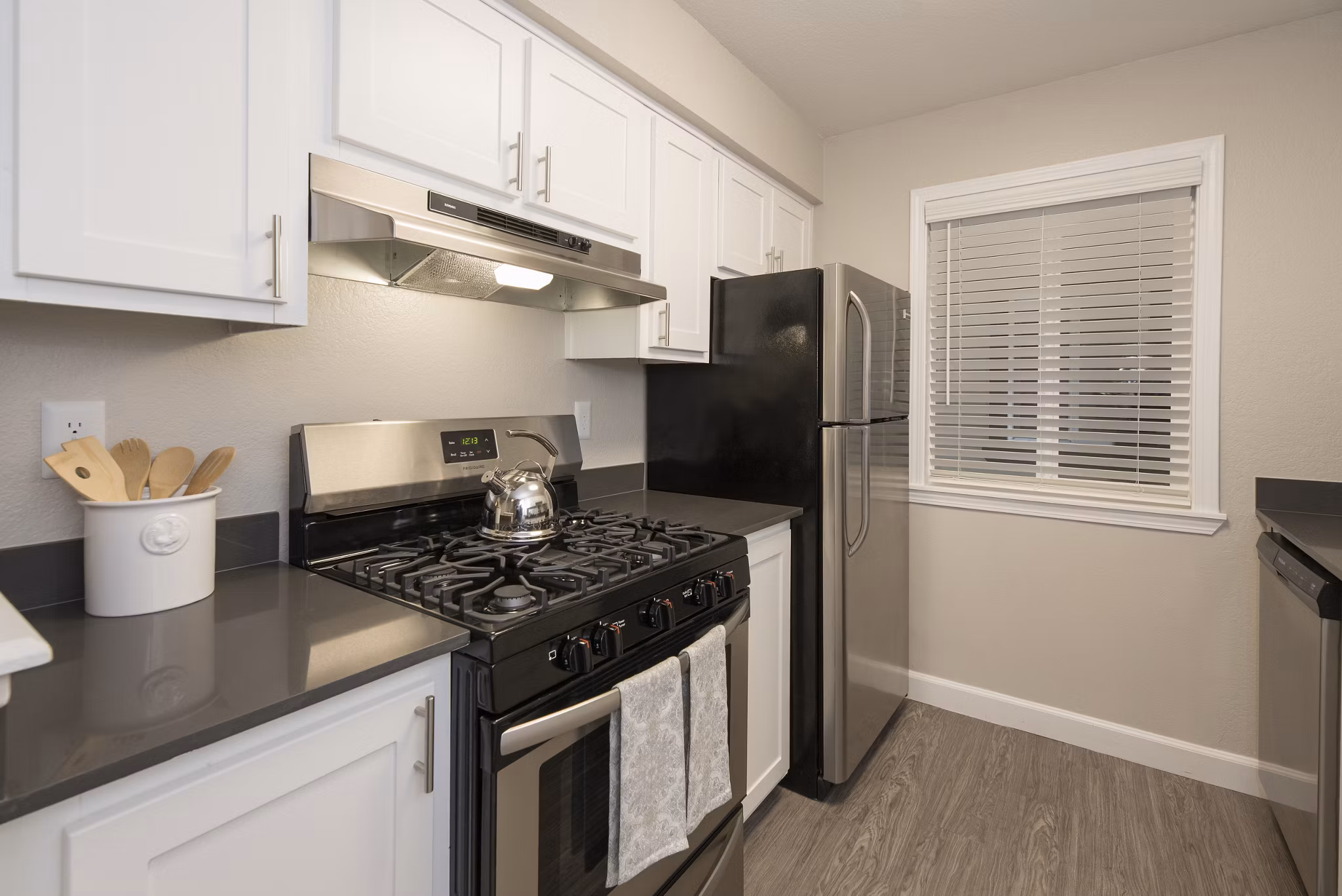 Modern kitchen with stainless steel appliances at The Hills Apartments