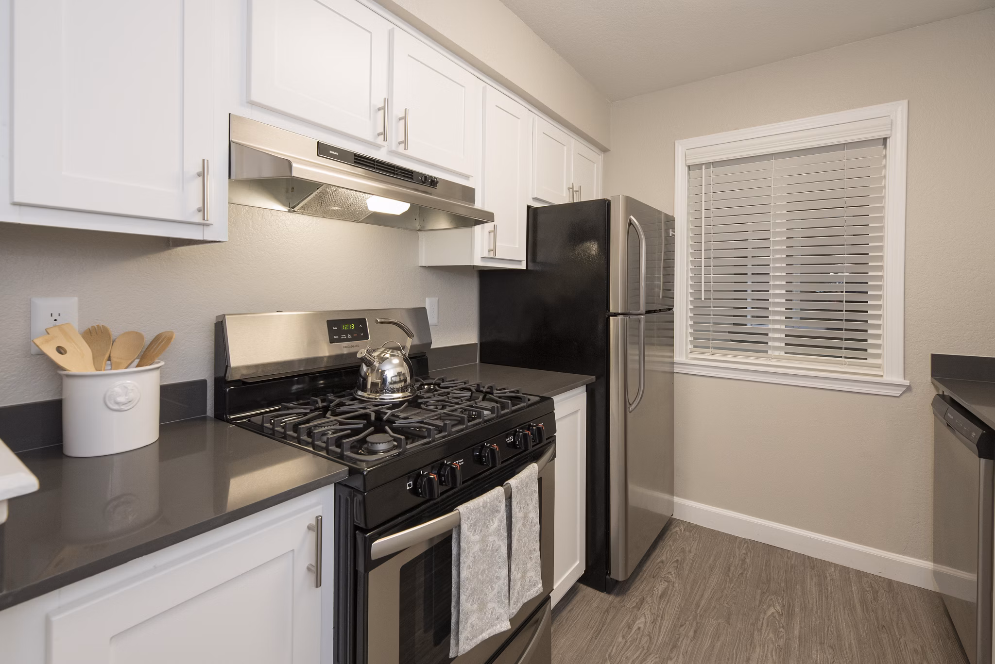 Modern kitchen with stainless steel appliances at The Hills Apartments