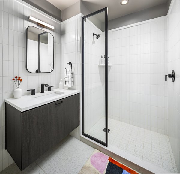 Modern bathroom with sleek fixtures at 1111 Church Apartments