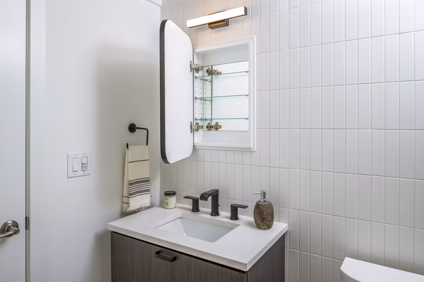 Luxurious bathroom with marble countertops and modern fixtures in 1111 Church Apartments Perfect for Greystar luxury apartment living