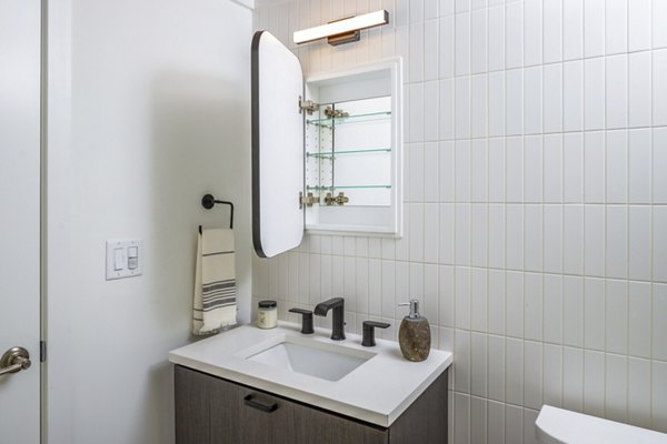 Luxurious bathroom with marble countertops and modern fixtures in 1111 Church Apartments Perfect for Greystar luxury apartment living