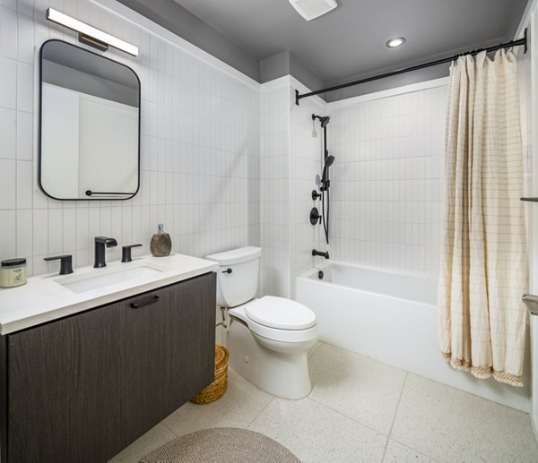 Luxurious bathroom featuring elegant marble countertops at 1111 Church Apartments