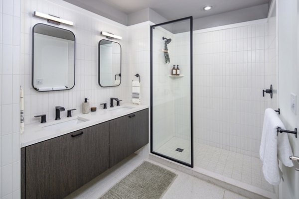 Bathroom with sleek fixtures and modern design at 1111 Church Apartments