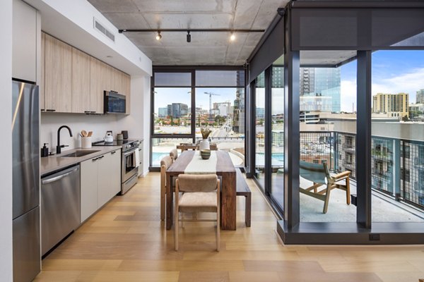 Dining room with elegant chandelier and modern decor at 1111 Church Apartments