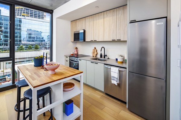 Sleek modern kitchen with stainless steel appliances at 1111 Church Apartments, a Greystar luxury community in downtown