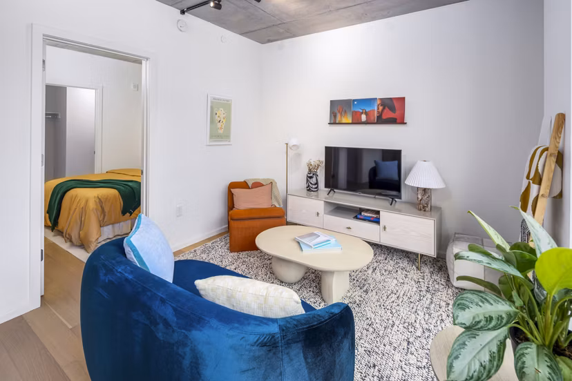 Spacious living room with modern furnishings at 1111 Church Apartments