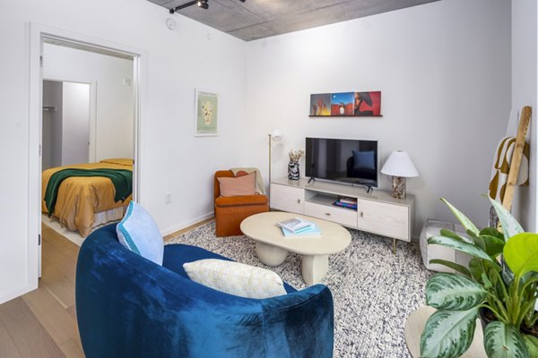 Spacious living room with modern furnishings at 1111 Church Apartments