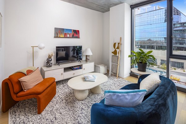 Spacious living room with modern decor at 1111 Church Apartments, a Greystar luxury property