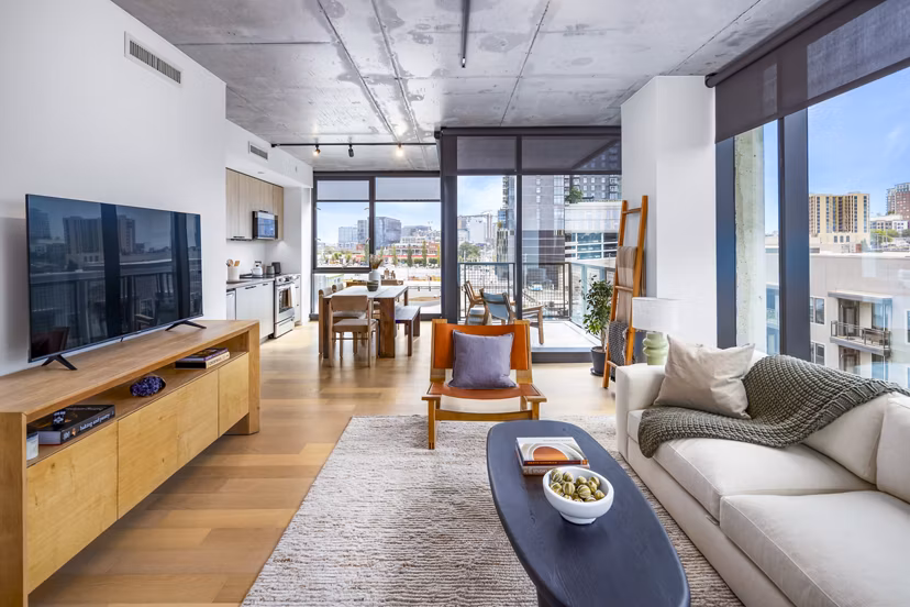 Living room with modern furnishings and elegant decor at 1111 Church Apartments, a luxury property by Greystar
