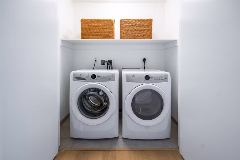 Convenient laundry room with modern appliances at 1111 Church Apartments