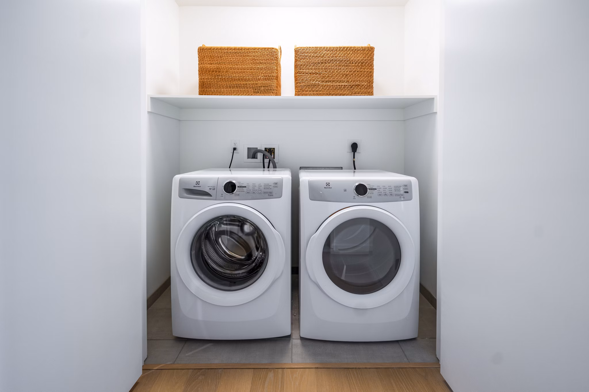 Convenient laundry room with modern appliances at 1111 Church Apartments