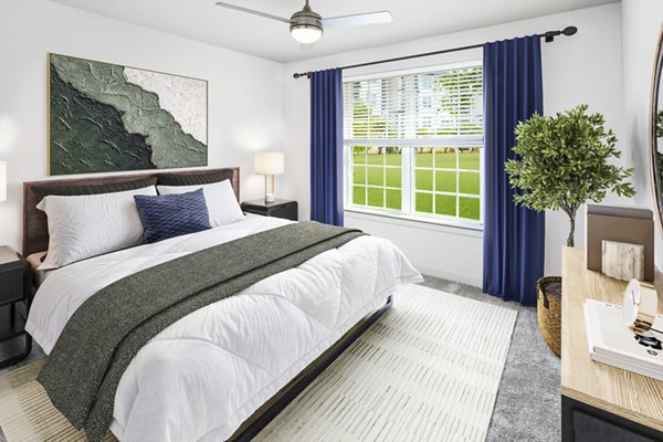 Cozy bedroom with modern decor at Elan Sweetwater Creek Apartments
