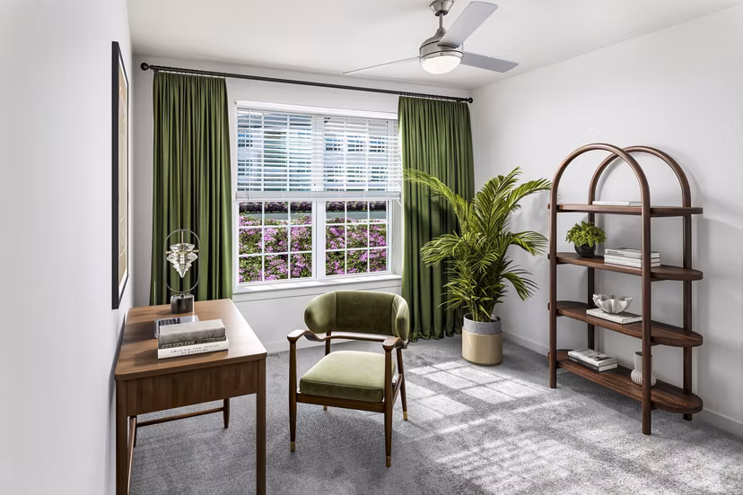 Bedroom featuring elegant decor and ample natural light at Elan Sweetwater Creek Apartments
