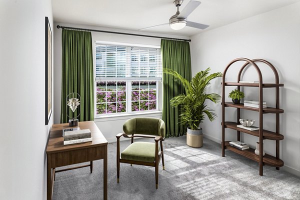 Bedroom featuring elegant decor and ample natural light at Elan Sweetwater Creek Apartments