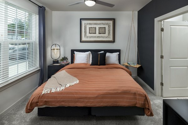 Spacious bedroom with modern decor at Elan Sweetwater Creek Apartments