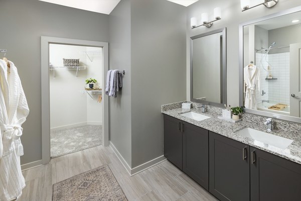 Luxurious bathroom with modern fittings at Elan Sweetwater Creek Apartments, designed for comfort and style