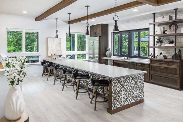 Clubhouse with modern design and spacious seating at Elan Sweetwater Creek Apartments