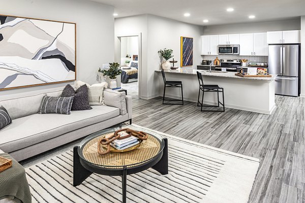 Bright living room with contemporary decor at Elan Sweetwater Creek Apartments, offering luxury and comfort in every detail