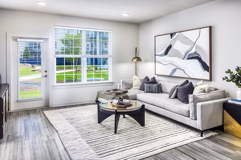 Spacious living room with modern decor at Elan Sweetwater Creek Apartments
