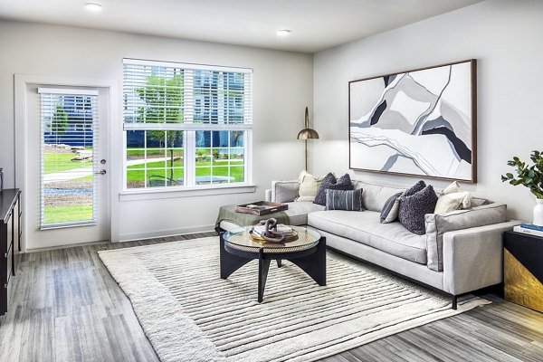 Spacious living room with modern decor at Elan Sweetwater Creek Apartments