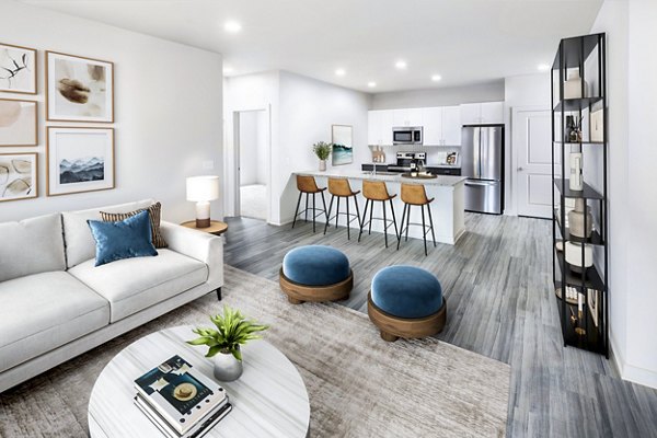 Spacious living room with modern furnishings at Elan Sweetwater Creek apartments