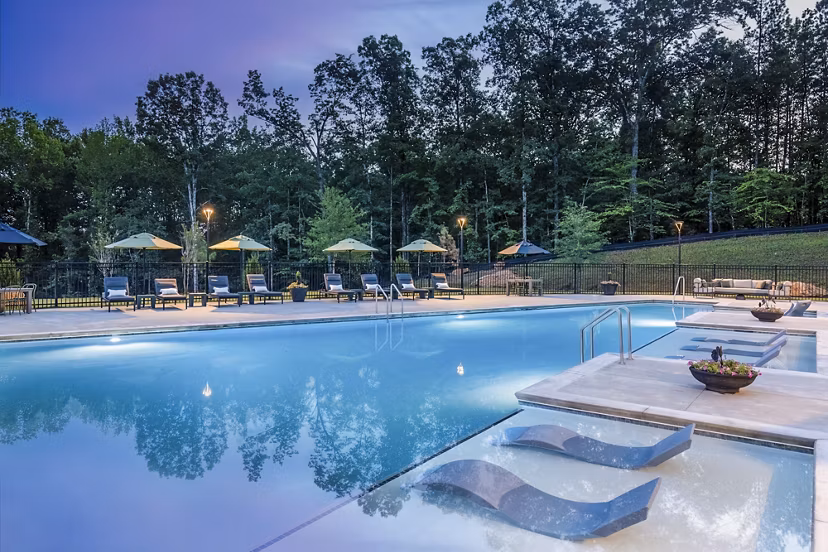 Luxurious pool at Elan Sweetwater Creek Apartments, Douglasville, with ample lounging space and resort-style amenities for a relaxing experience