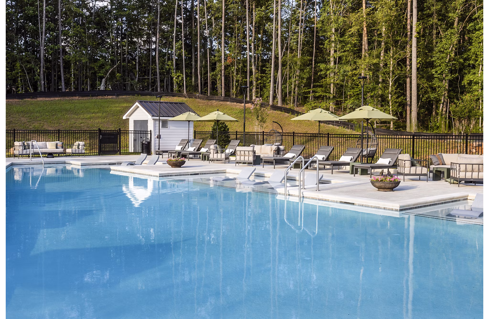 Resort-style pool with cabanas at Elan Sweetwater Creek Apartments, luxury living in scenic surroundings