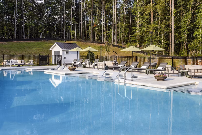 Resort-style pool with cabanas at Elan Sweetwater Creek Apartments, luxury living in scenic surroundings