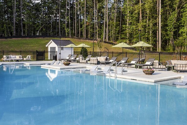 Resort-style pool with cabanas at Elan Sweetwater Creek Apartments, luxury living in scenic surroundings
