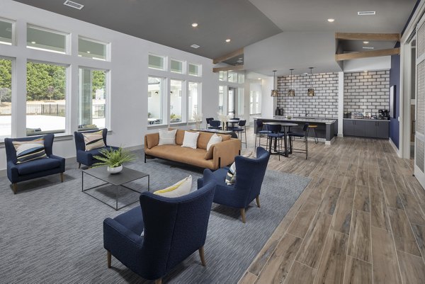 Clubhouse at Prose New Hope Apartments: Modern communal space with cozy seating and entertainment options, perfect for residents to relax and socialize