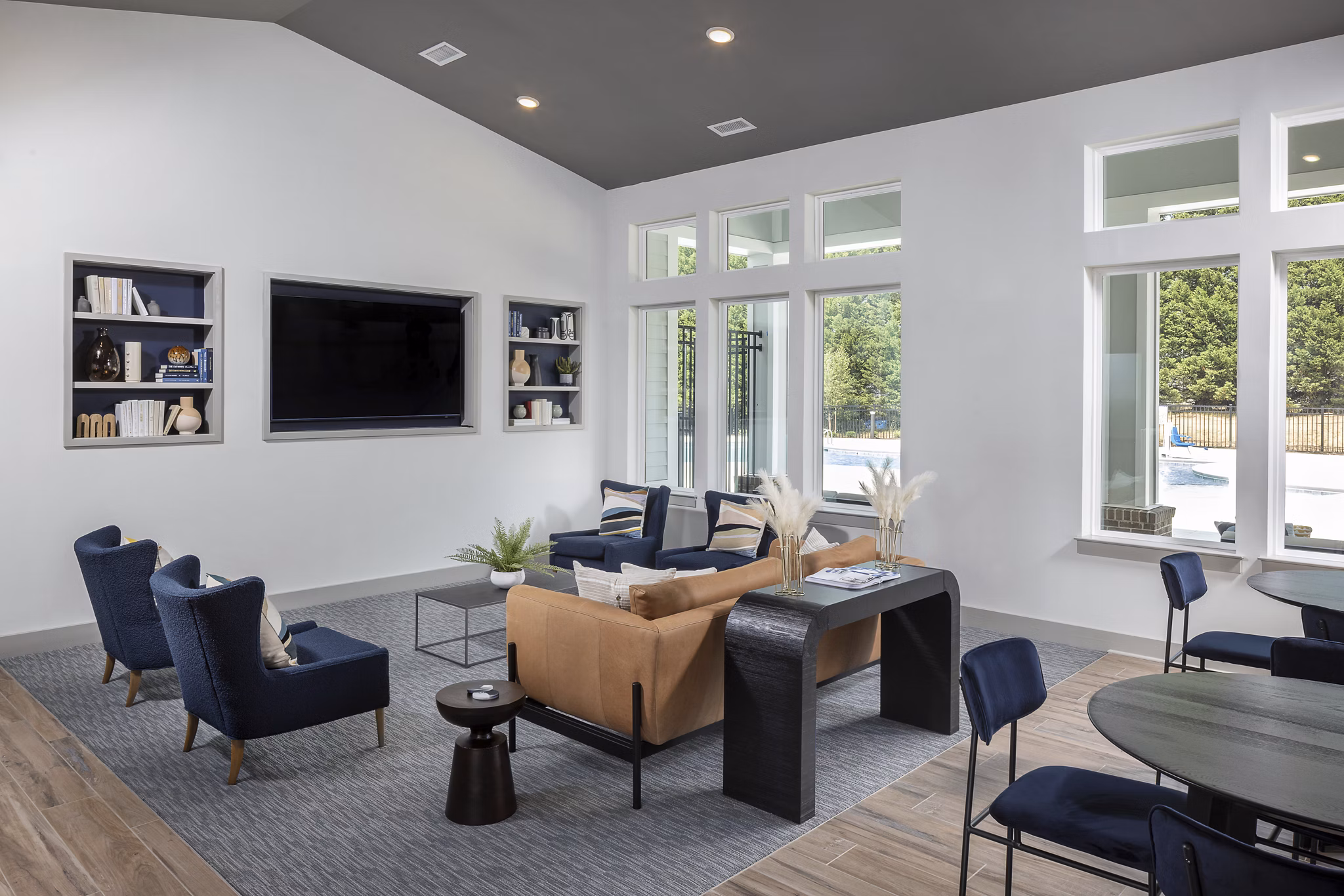 Modern clubhouse with seating area and kitchen at Prose New Hope Apartments, perfect for social gatherings and events