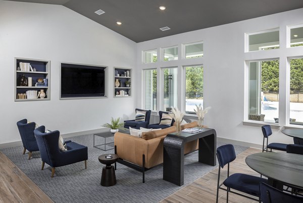 Modern clubhouse with seating area and kitchen at Prose New Hope Apartments, perfect for social gatherings and events