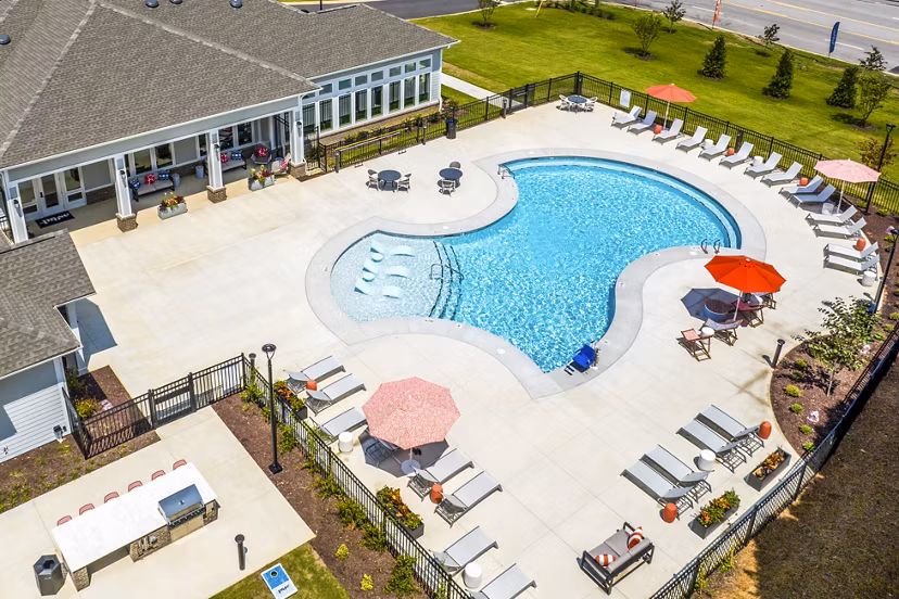 Modern pool with lounge chairs at Prose New Hope Apartments, offering residents a luxurious spot to relax and unwind